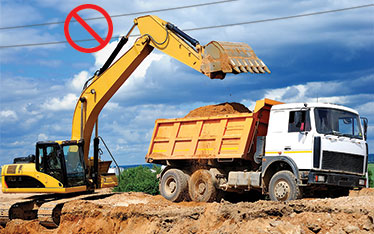 Dump truck too close to power lines