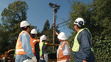 Contractor pointing at power lines