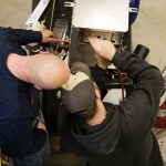 One man working with another on HVA training