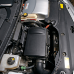 Car with hood open to show engine and other parts